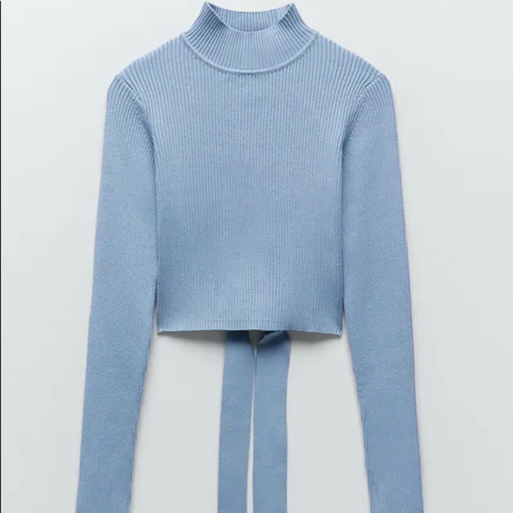 Blue open back knit sweater